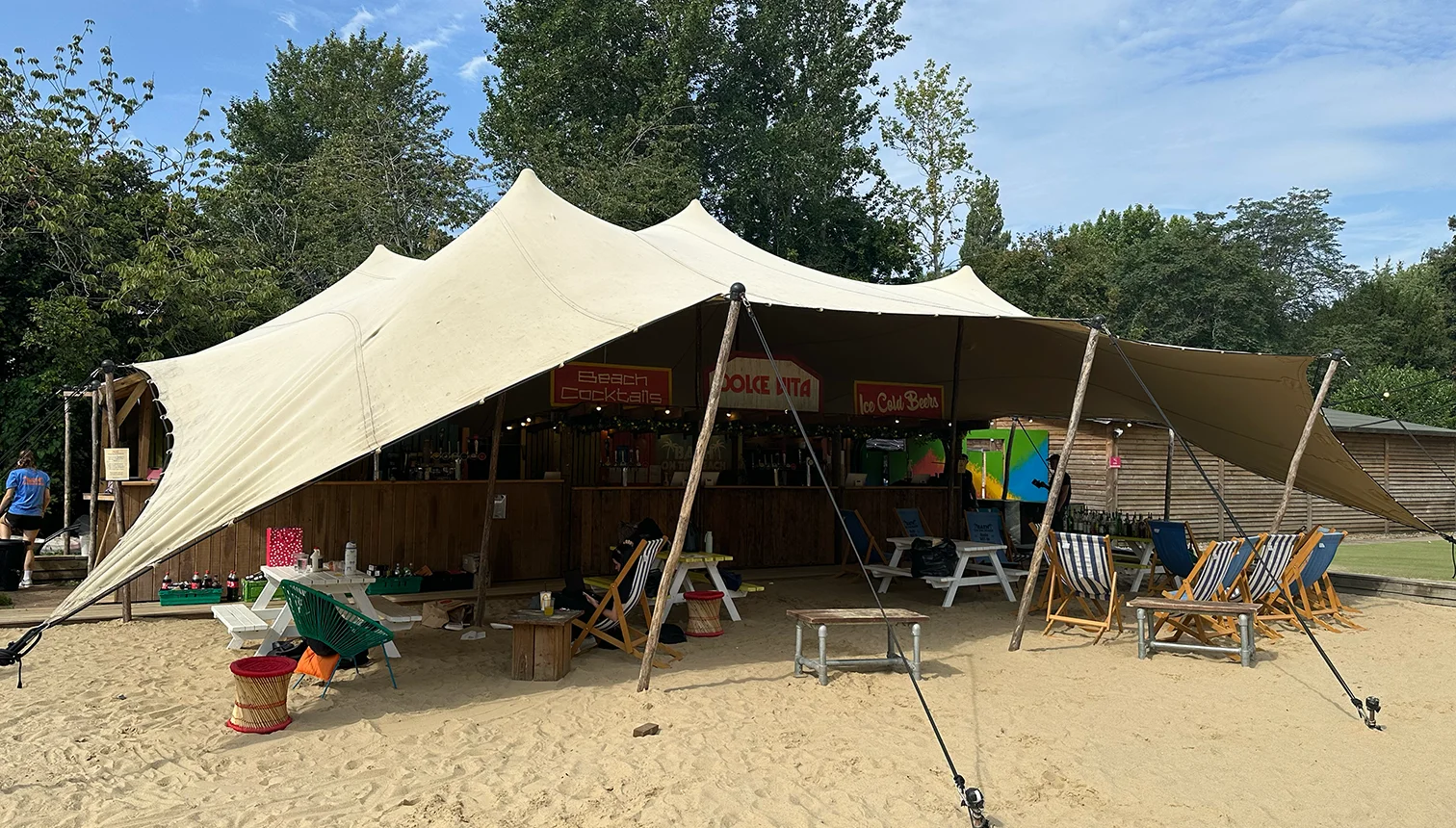 Large stretch tent covering an outdoor music festival area