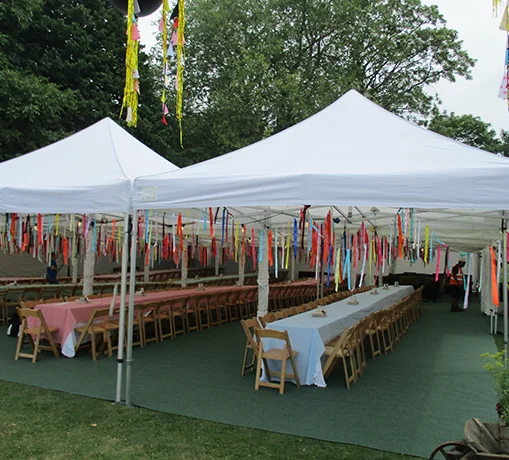 Pop-up marquee with tables and operational event equipment